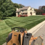 completed lawn care job and Scag Mower